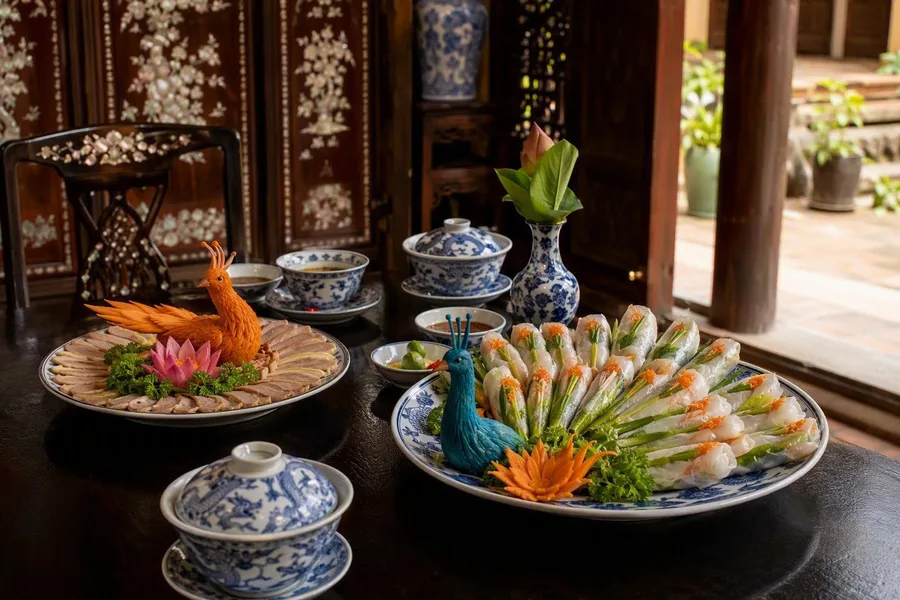 Peacock-shaped spring rolls and phoenix-shaped pork are served at Y Thảo Garden in Huế.